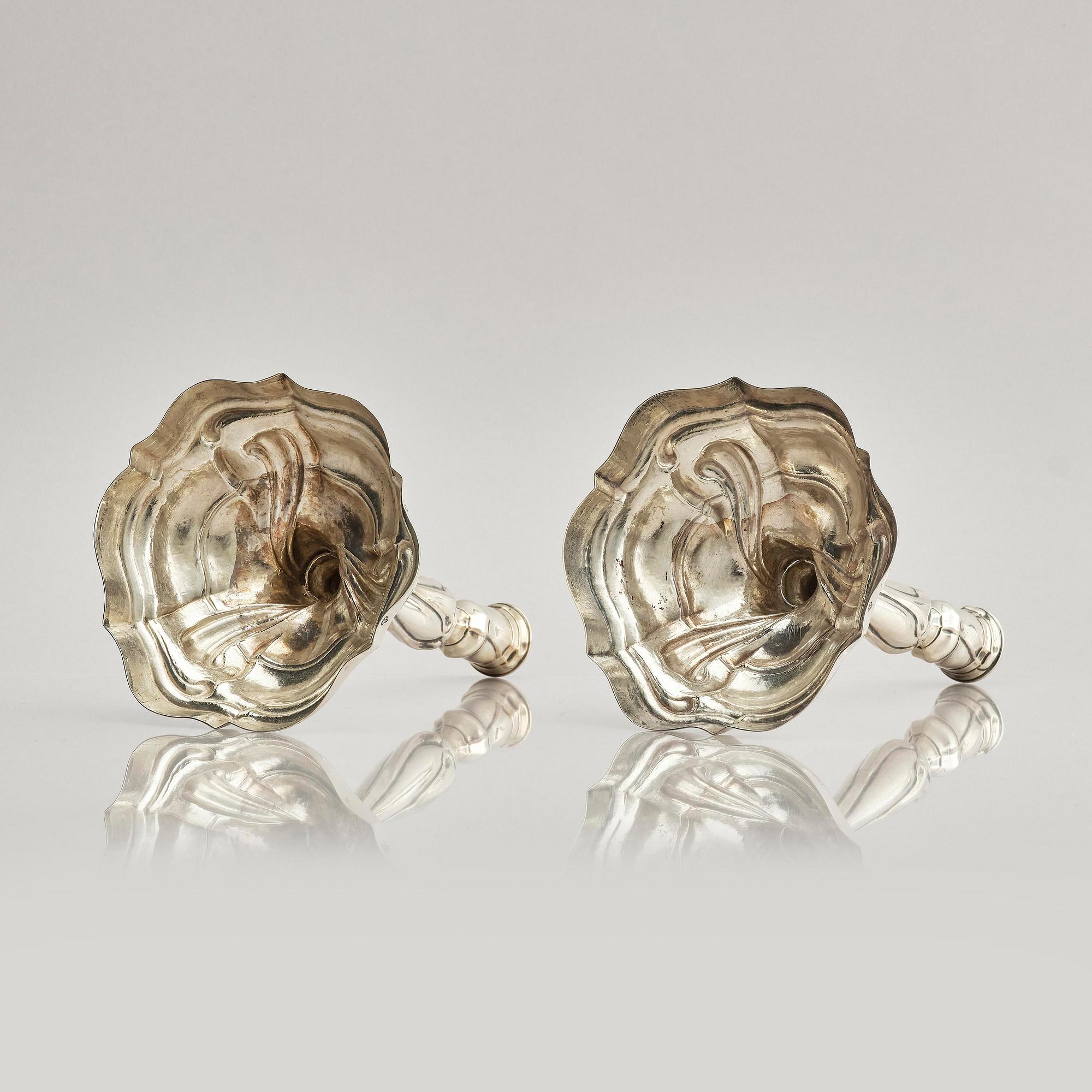 A pair of German silver Rococo candlesticks, marks of Johann Jacob Baur, Augsburg 1777-1779.