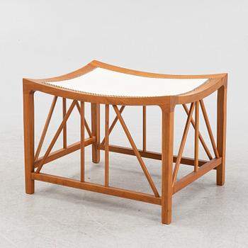 Josef Frank, a model 1063 cherry wood stool, Firma Svenskt Tenn, 21st Century.
