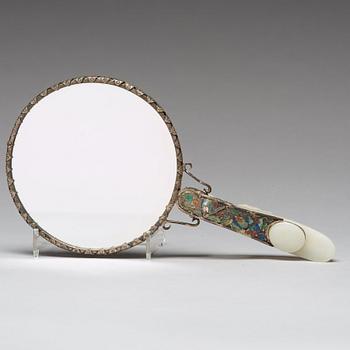 A Chinese silver mirror with carved nephrite placque and belt hook, early 20th Century.