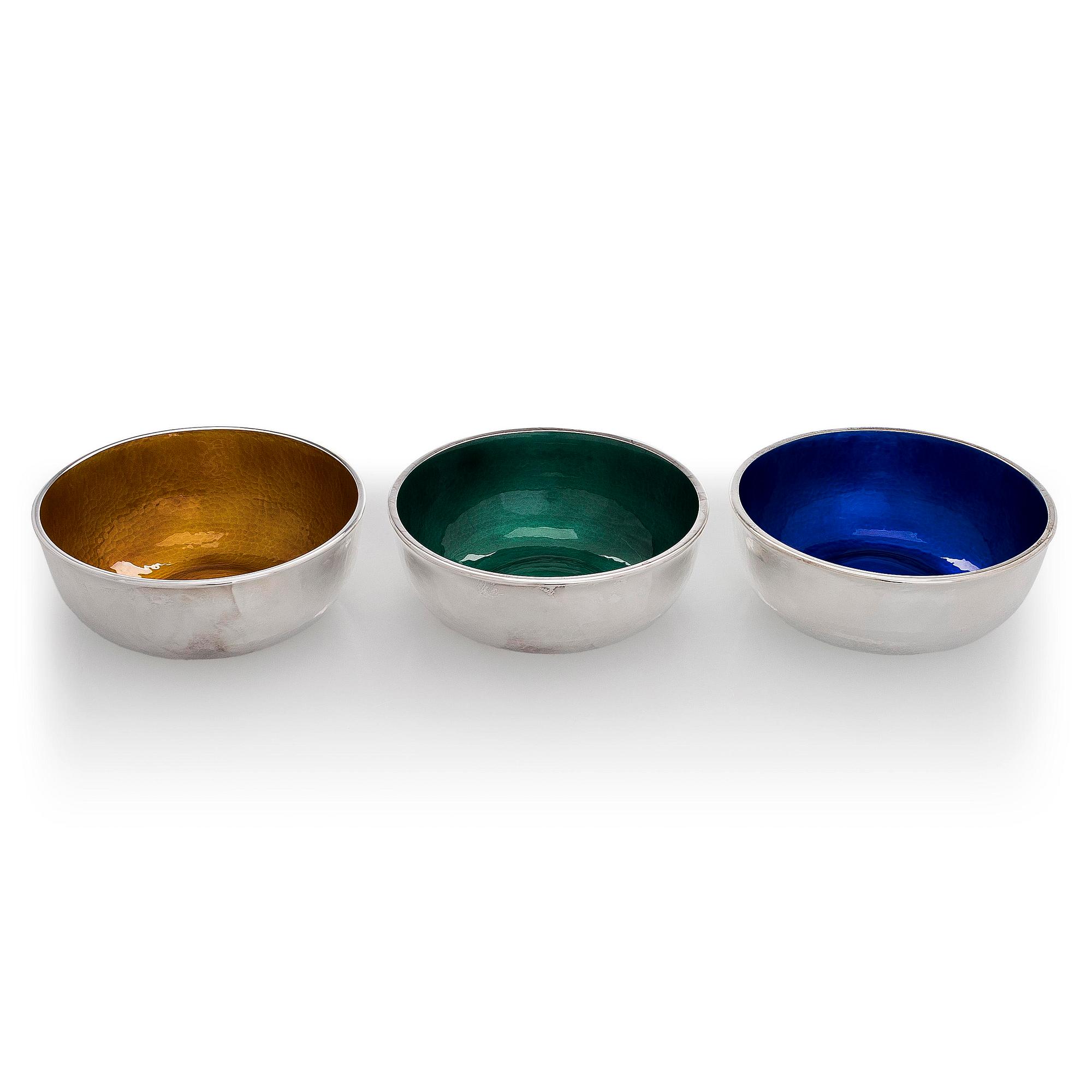 A set of three sterling silver and enamel bowls, maker's mark of A. Tillander, Turku 2005.