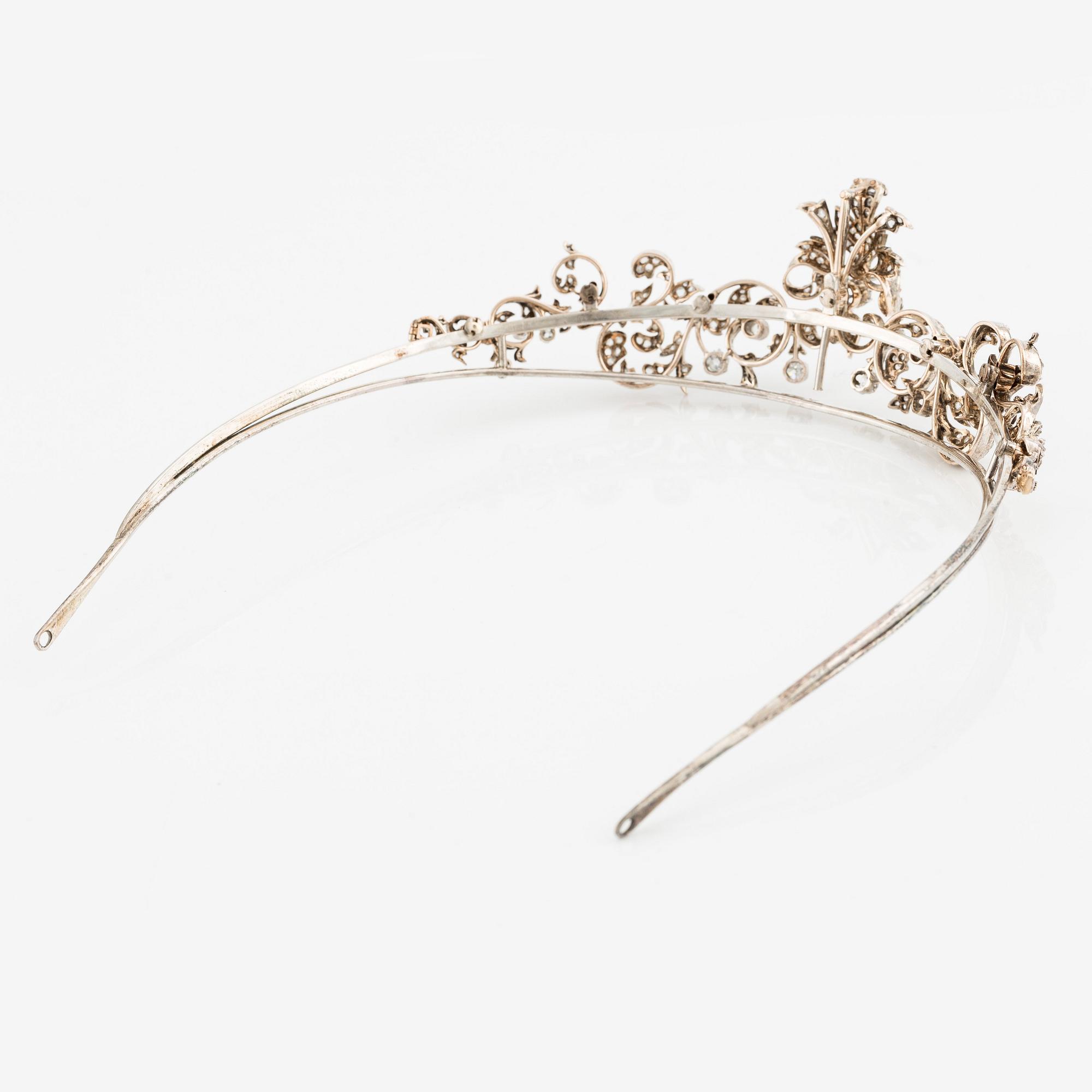 An 18K gold and silver tiara composed of scroll motifs set with old ...