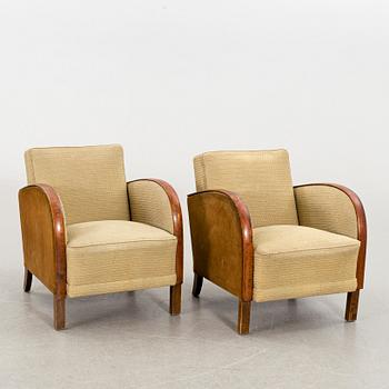 A pair of first half of the 20th century lounge chairs.