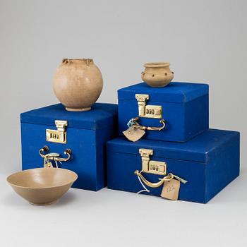 A brown glazed bowl and two pots, South East Asia, 17th Century or older.