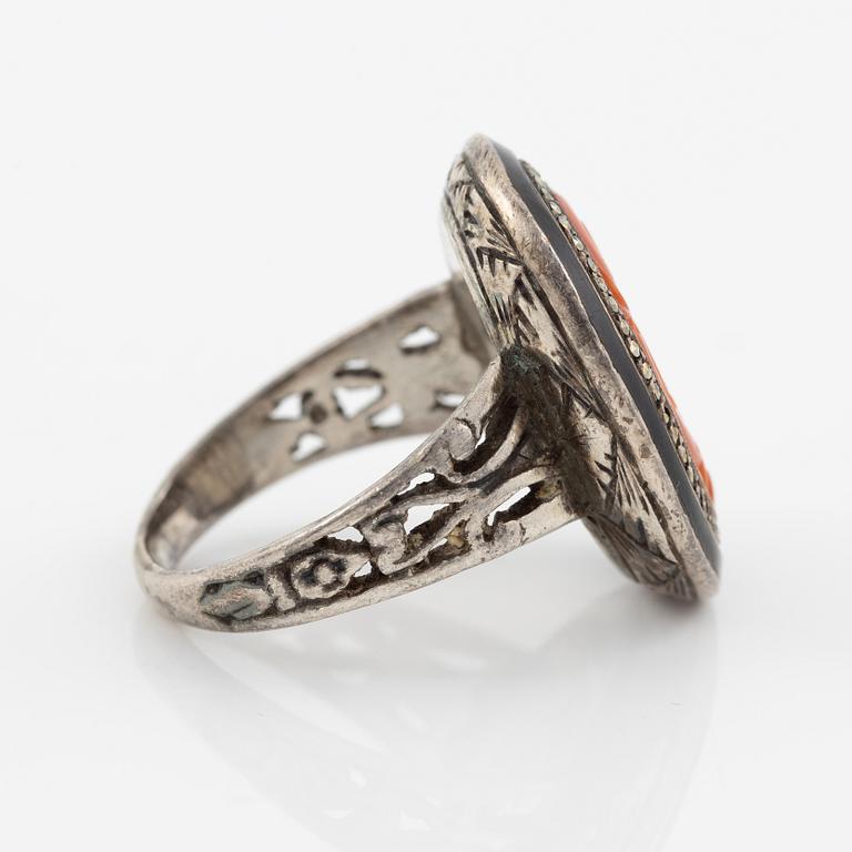 Silver ring with coral and marcasites and with black details.