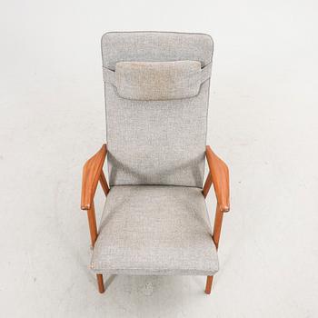 A 1960s teak armchair.