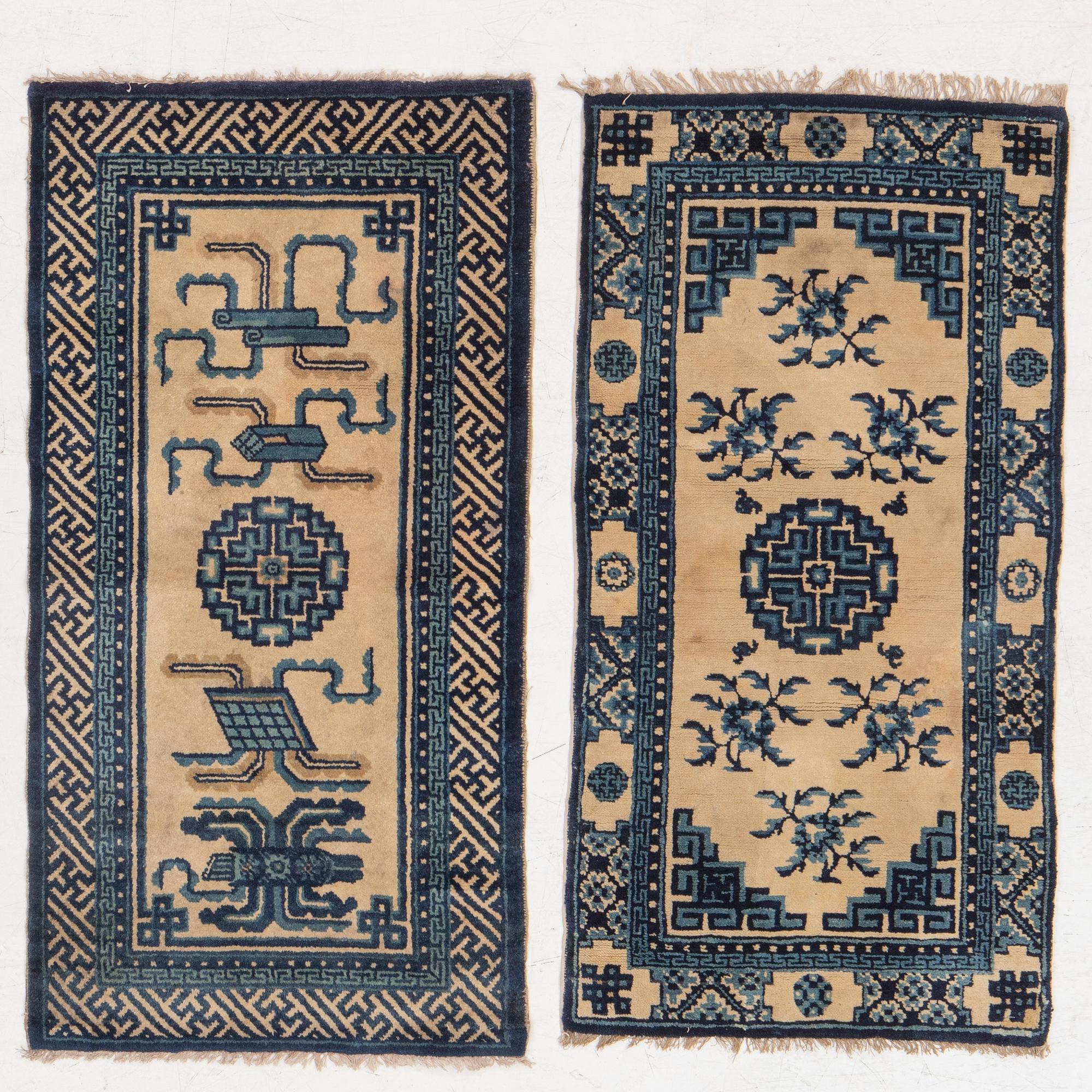 Two antique Chinese Pao-Tow rugs, c. 125 x 65 and 125 x 60 cm.