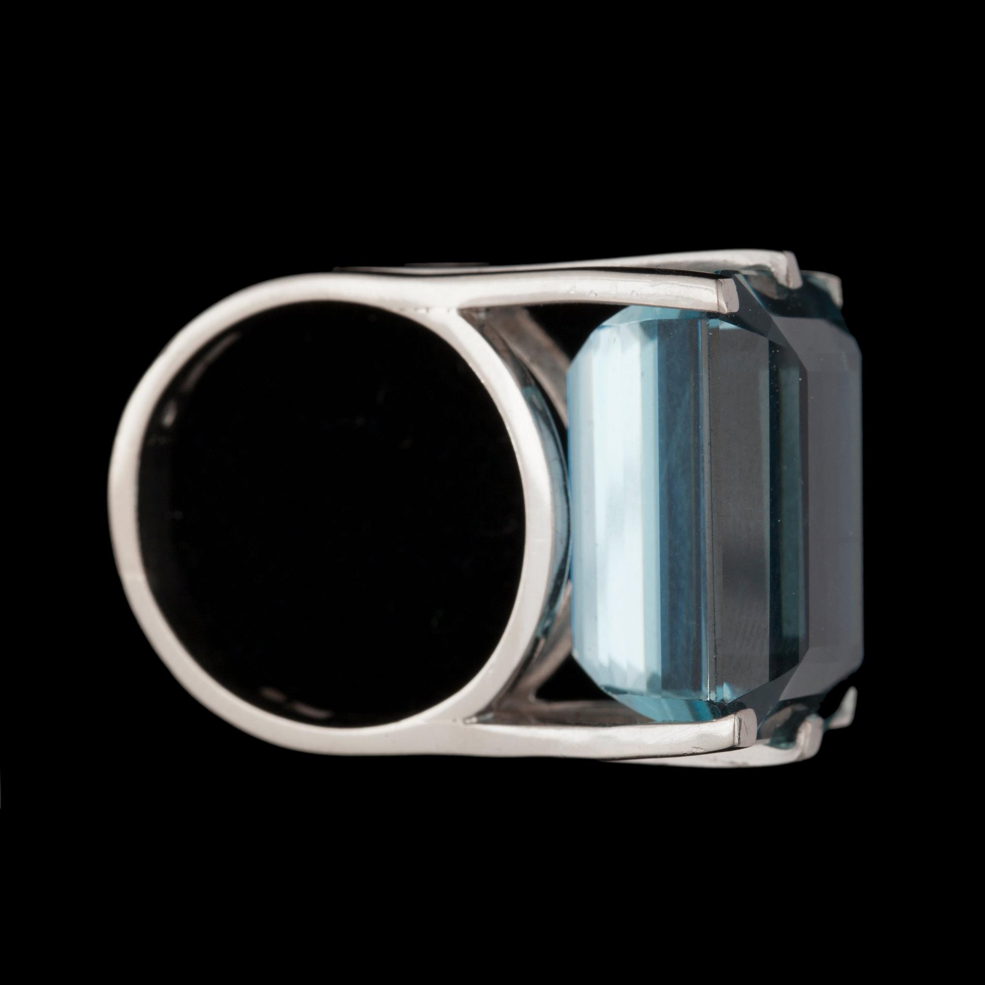 A step-cut aquamarine, 25.13 cts, ring.