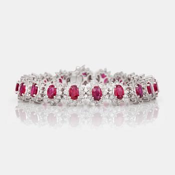 An oval-cut ruby and brilliant-cut diamond bracelet.