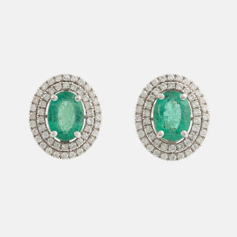 Emerald and brilliant cut diamond earrings.
