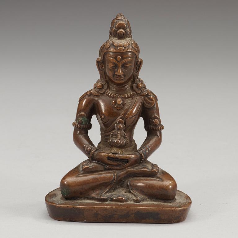 A copper alloy figure of Amitayus, Tibet/Nepal, presumably late 19th century/early 20th century.