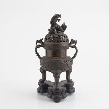 A tripod bronze censer with cover, Qing dynasty, 19th century.