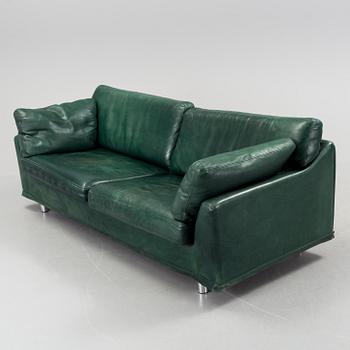 A "Fredrik" green leather sofa by Dux.