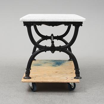 An end of the 20th Century aluminum and marble garden table.