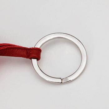 HERMÈS, a key holder in burgundy red leather, "Carmen".