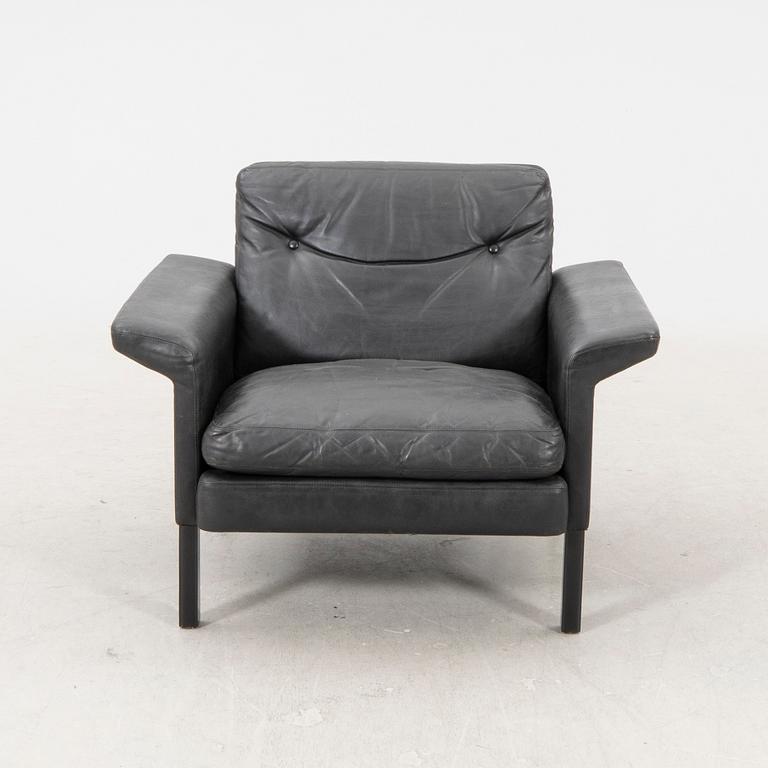 A 1960/70s Hans Olsen leather armchair.