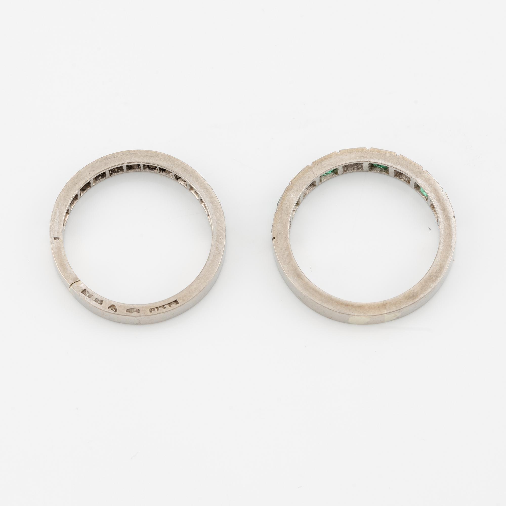 Rings, 2 pcs, alliance rings, 18K white gold with diamonds, one of them with diamonds and emeralds.