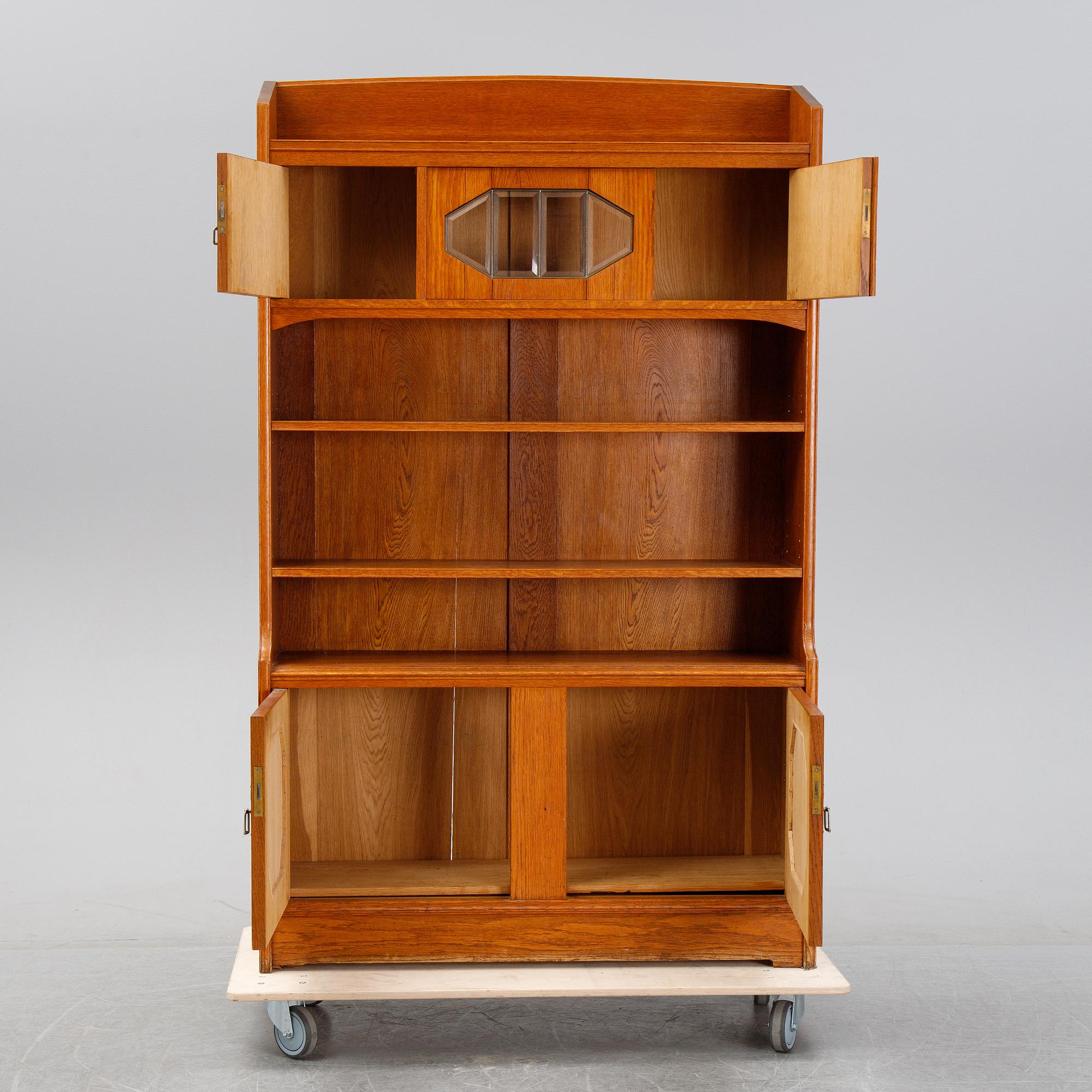 An oak cabinet and bookcase, early 20th Century.