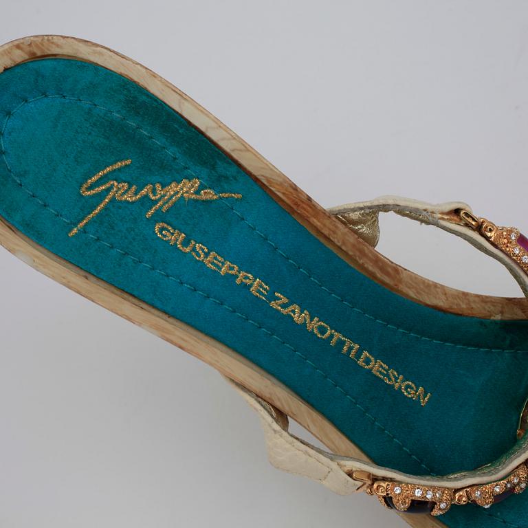 GIUSEPPE ZANOTTI, a pair of wedge heeled sandalettes with paste.