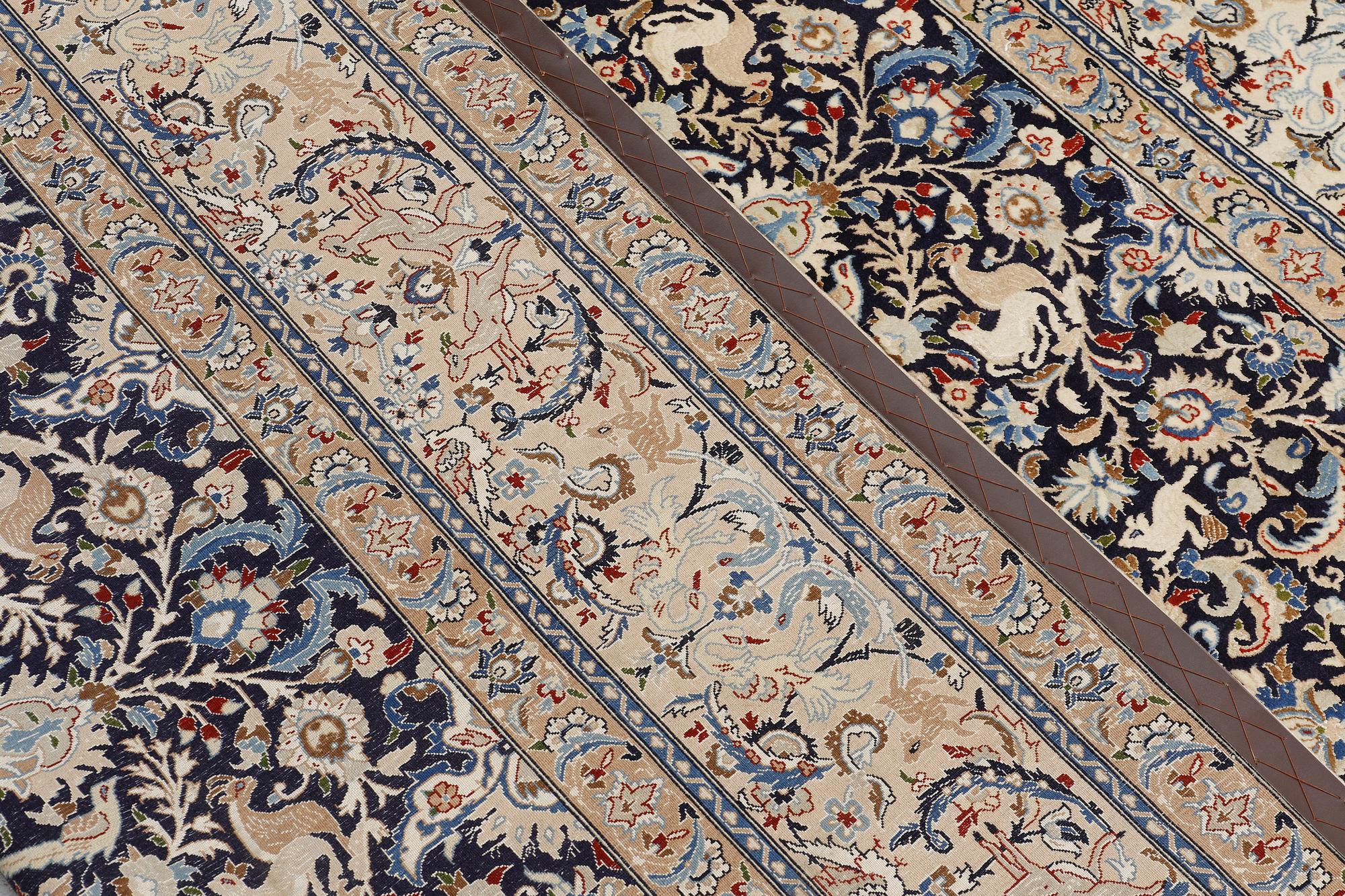A Nain carpet, part silk, so-called 6 LAA, approx. 324 x 210 cm.