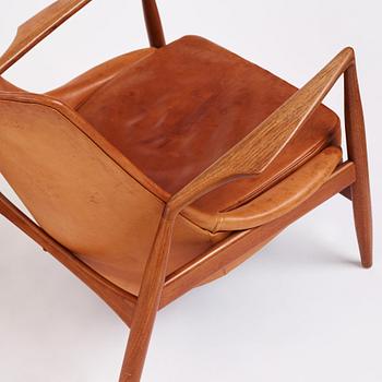 Ib Kofod Larsen, a pair of teak and cognac coloured leather "Sälen" easy chairs, Olof Perssons Fåtöljindustri (OPE), Sweden, 1950-60's.