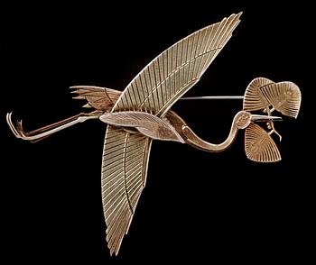 A Wiwen Nilsson gilt sterling brooch of a crane,