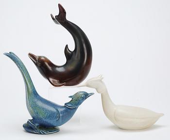 Three Gunnar Nylund stoneware figures, a dolphin, a pheasant and a great crested grebe, Rörstrand.