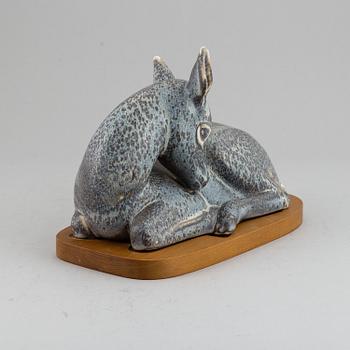 GUNNAR NYLUND, a unique stoneware sculpture of a reclining deer, Rörstrand, Sweden mid 20th Century.