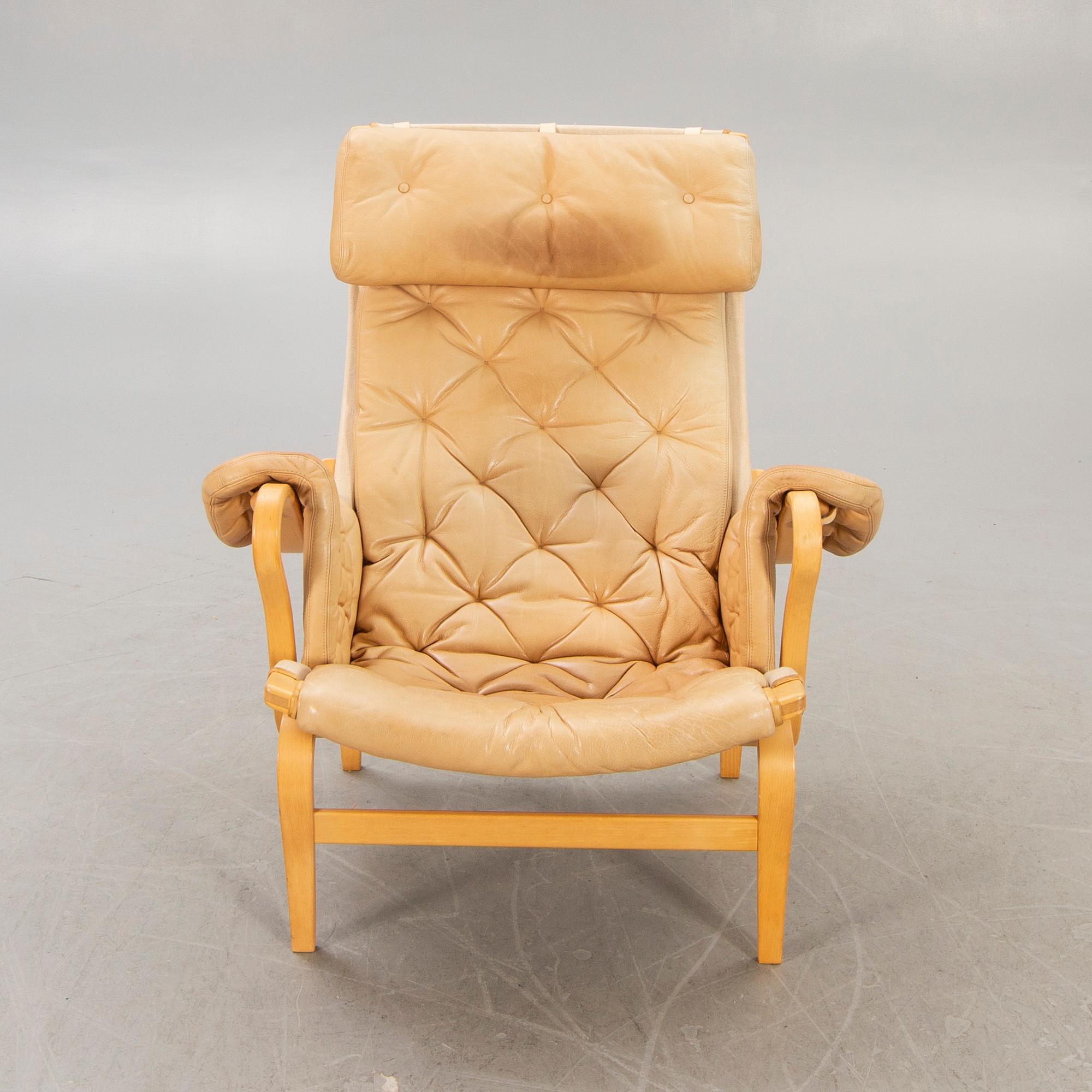 A Bruno Mathsson "Pernilla" leather easy chair for DUX later part of the 20th century.