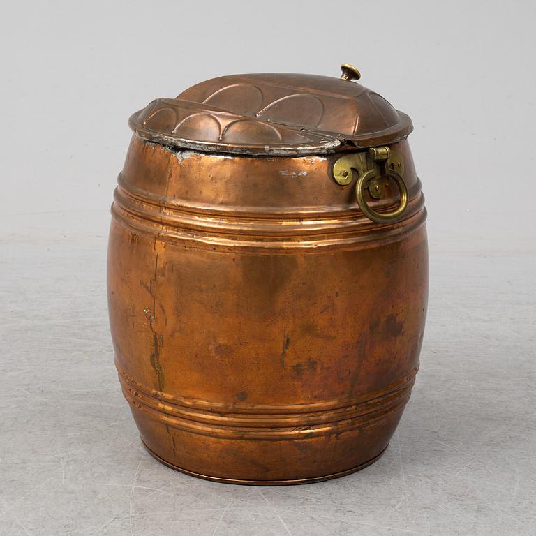 A 19th century copper water barrel.