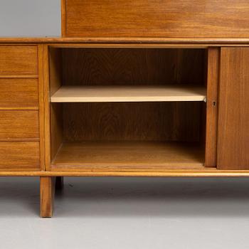 Josef Frank, a mahogny sideboard with cabinets, shelves, writing flap and drawers, Svenskt Tenn, a special commission, 1940-50s.