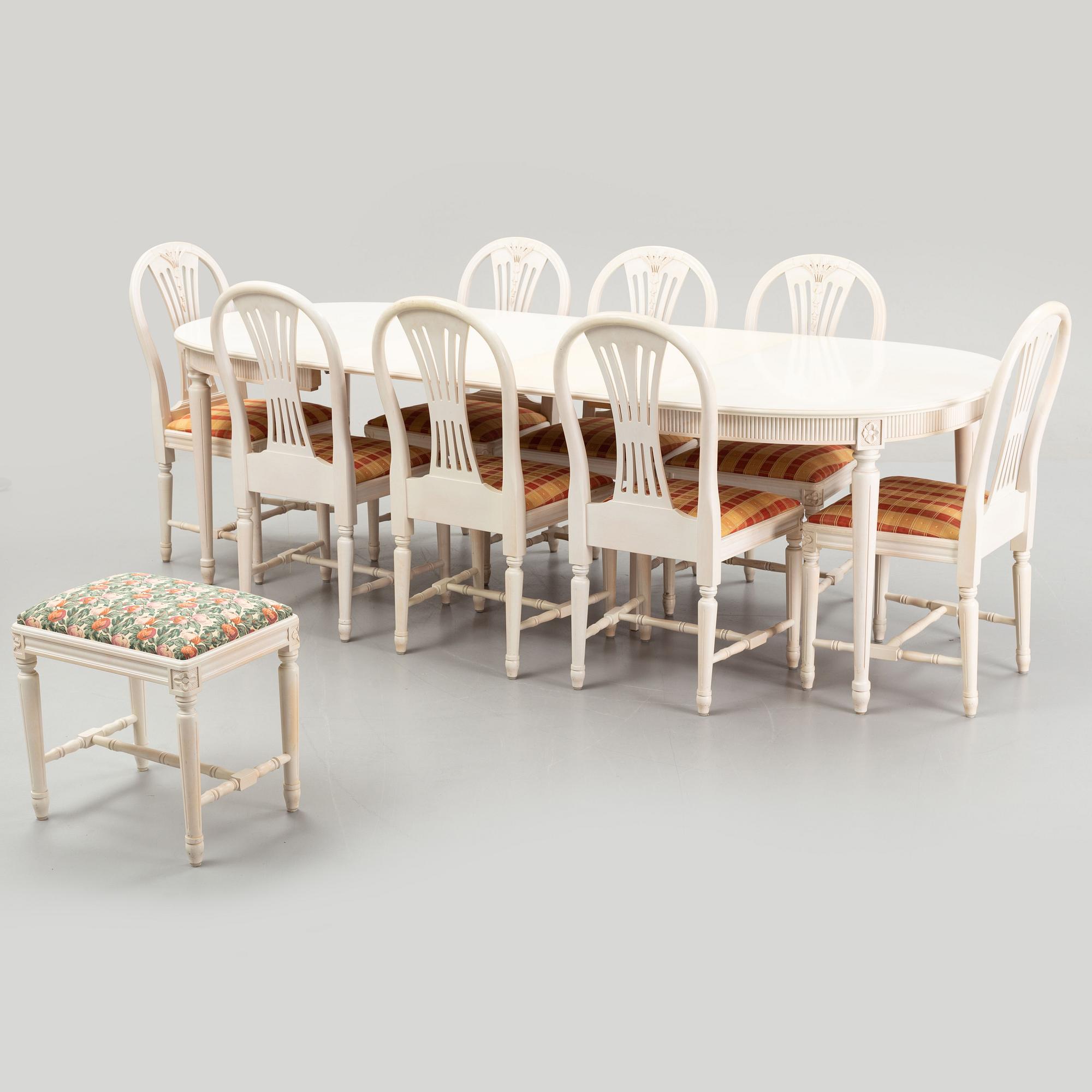 A dining table with eight chairs and a stool, Gustavian style, second half of the 20th Century.