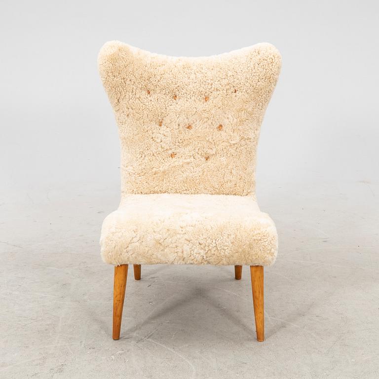 A Swedish Modern 1940s sheep skin armchair.