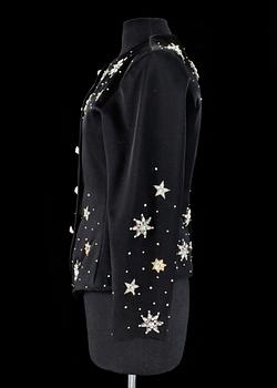 A black evening jacket by Yves Saint Laurent.