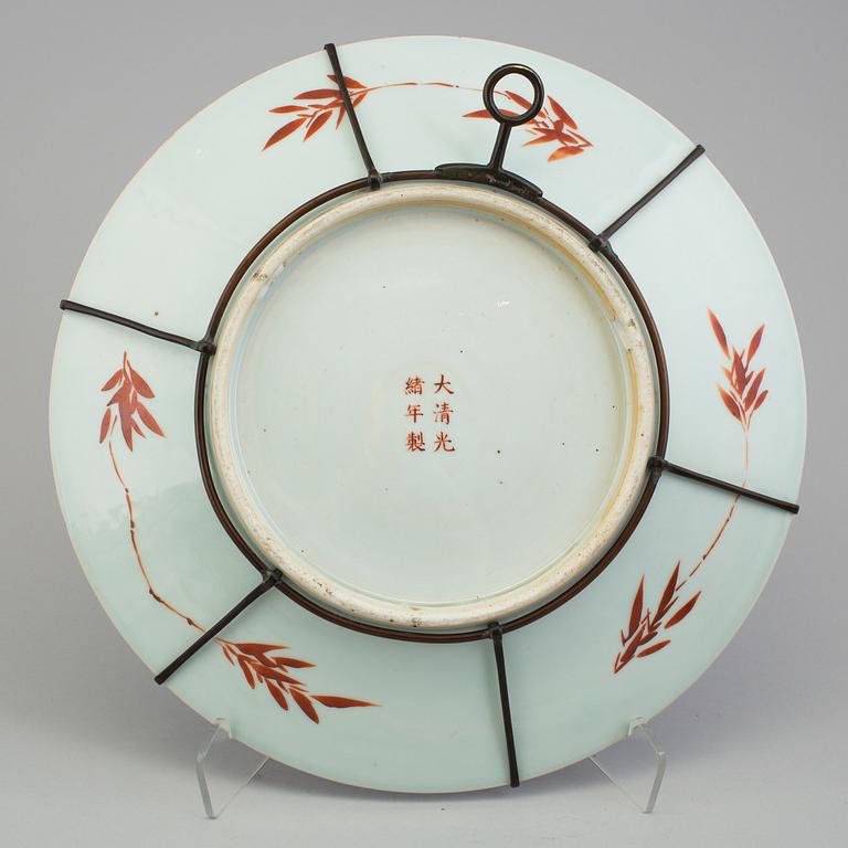 A Chinese blue and white porcelain charger, 20th century, with Guangxus six character mark.