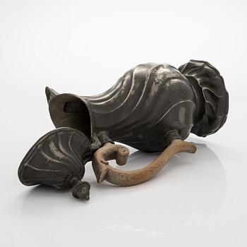 A mid 18th century rococo pewter jug.