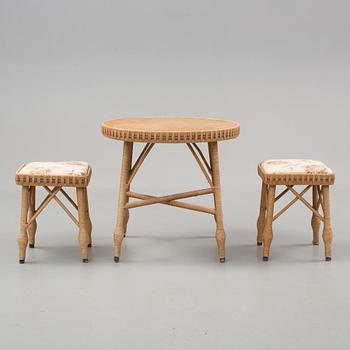 A mid 20th cenury table and a pair of stools.