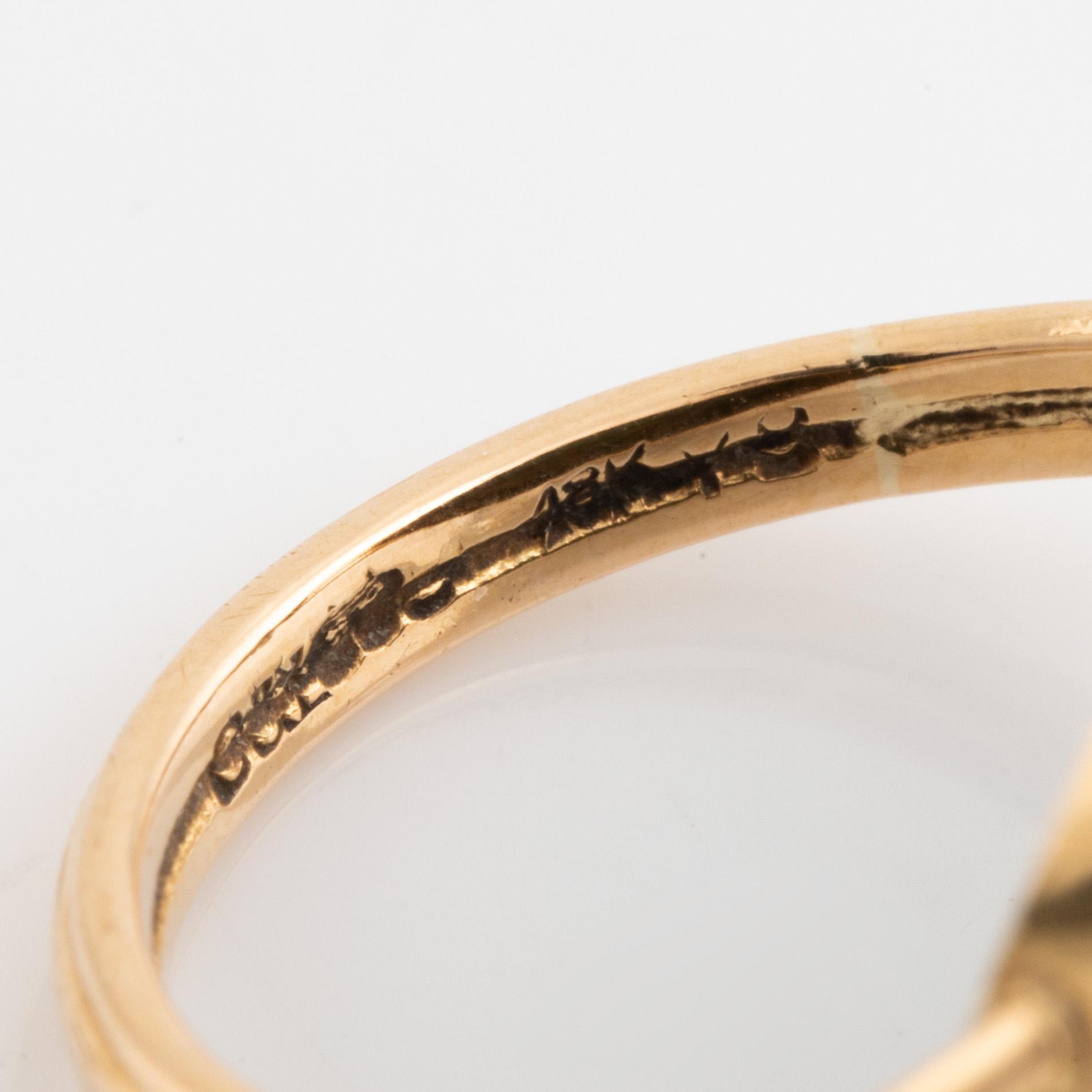 Green carved stone ring.