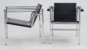 A pair of Le Corbusier 'LC 1' black leather  and chromed steel armchairs, Cassina, Italy.