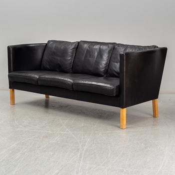 An 'AV59' sofa by Arne Vodder, Nielaus, Denmark.