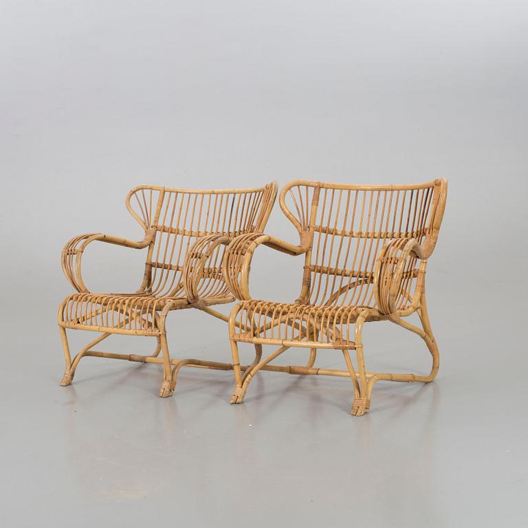 A mid 20th century ratten lounge chairs.