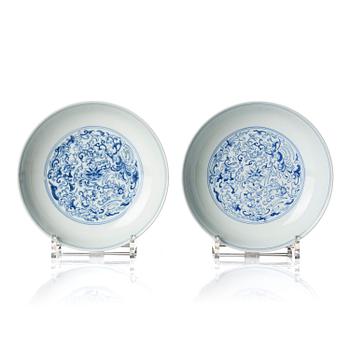 1335. A pair of blue and white 'Phoenix' dishes, Qing dynasty, Daoguang mark and of the period (1821-50).