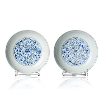 A pair of blue and white 'Phoenix' dishes, Qing dynasty, Daoguang mark and of the period (1821-50).