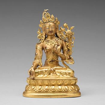 584. A gilt bronze figure of a White Tara, Tibetan-Chinese, 18th Century.