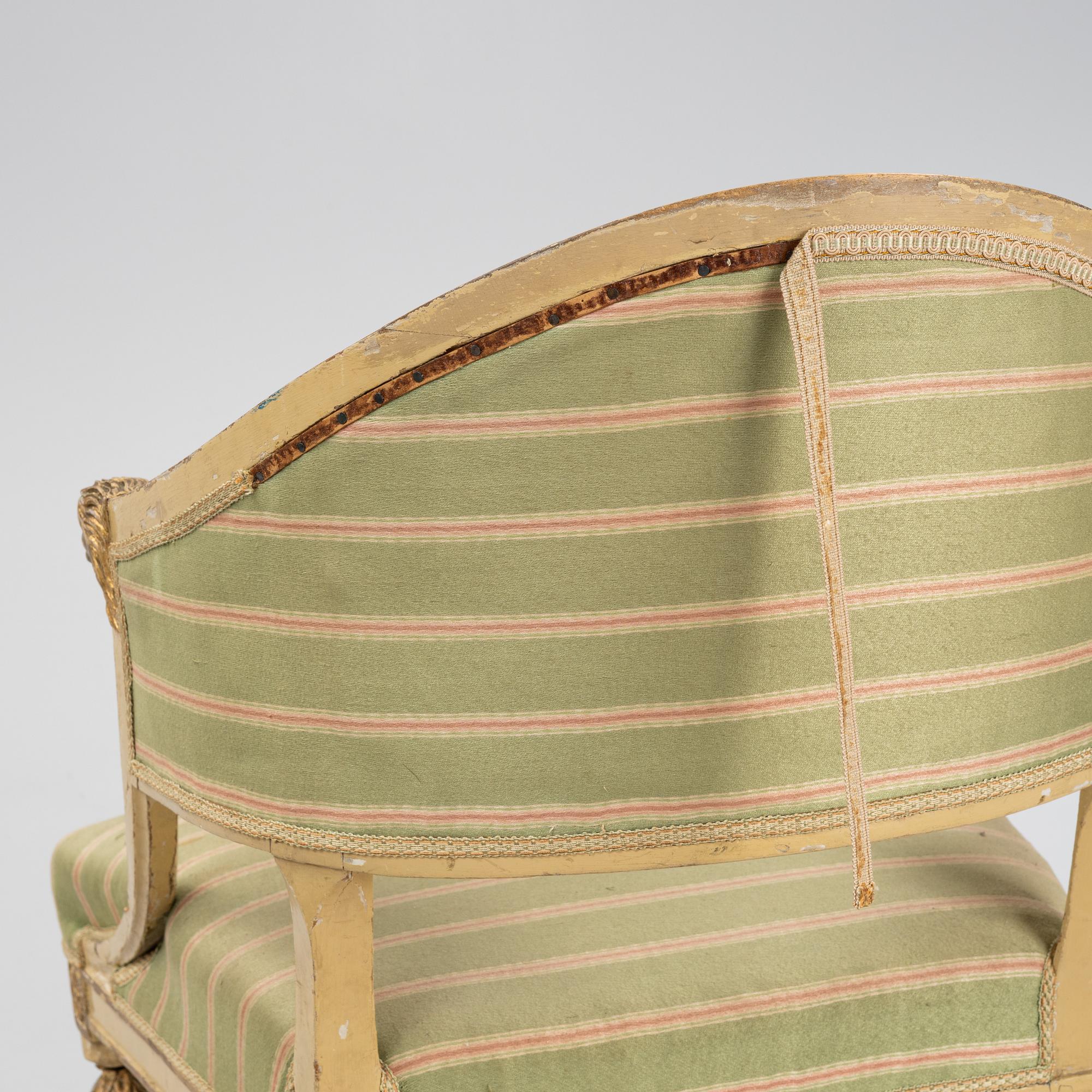 A matched pair of Gustavian style armchairs. One from around the year 1800 and one from around the year 1900.