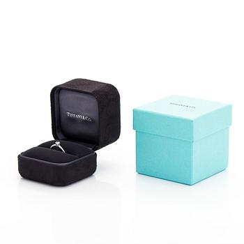 Tiffany & Co, a platinum solitaire ring with a brilliant-cut diamond.