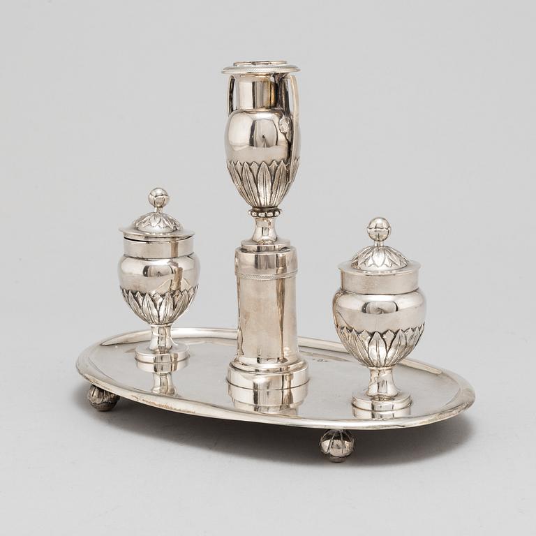 A 19th Century silver inkwell with candle holder.
