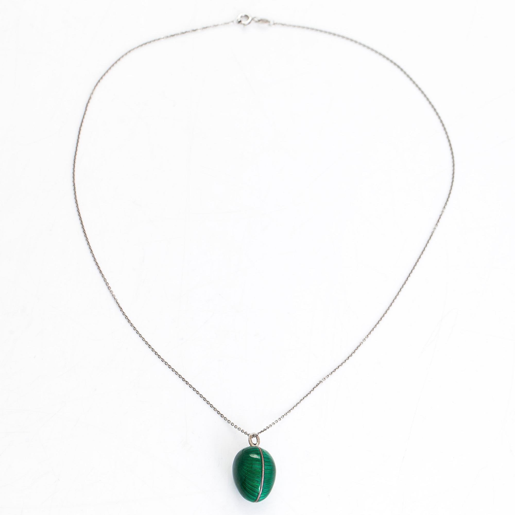 A sterling silver and enamel egg pendant. Tillander, Helsinki.