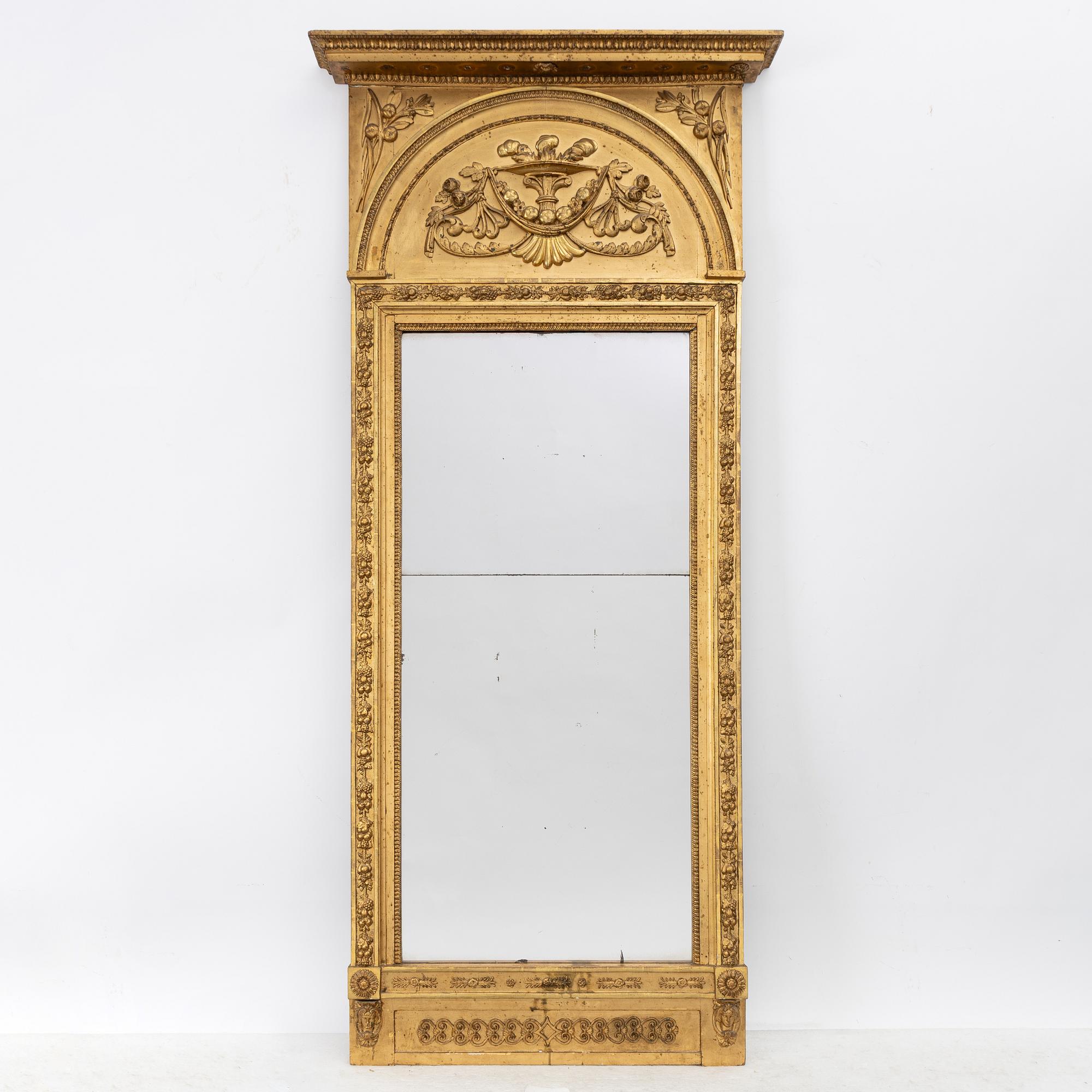 Empire, A late Empire mirror, first half of the 19th century.