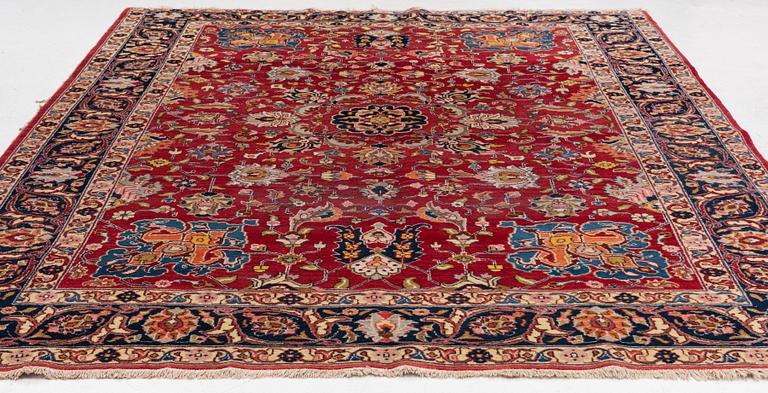 A semi-antique Tabriz carpet, c 358 x 248 cm.