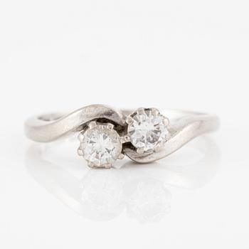Ring, 18K white gold with two brilliant-cut diamonds.